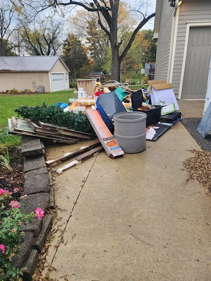 Dumpster being loaded with debris for Roofing Dumpster Rental in Lake Los Angeles